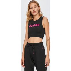 Guess Jeans - Biustonosz sportowy. Czarne biustonosze sportowe damskie Guess Jeans, s, z nadrukiem, z jeansu. Za 189,90 zł.