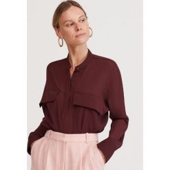 Bluzka z kieszeniami - Fioletowy. Fioletowe bluzki damskie Reserved, bez wzorów, bez kołnierzyka, bez rękawów. W wyprzedaży za 49,99 zł.