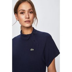Lacoste - Top. Białe bluzki damskie Lacoste, bez wzorów, z elastanu, bez kołnierzyka. W wyprzedaży za 429,90 zł.