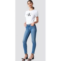 Calvin Klein Jeansy Mid Rise Skinny West - Blue. Niebieskie jeansy damskie marki Calvin Klein. Za 546,95 zł.