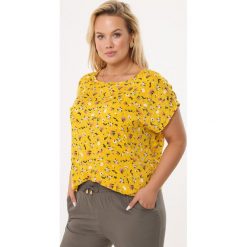 Żółta Bluzka Stellar Transport. Żółte bluzki damskie Born2be, xl, bez wzorów, bez kołnierzyka, bez rękawów. Za 39,99 zł.