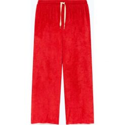 Spodnie "Ponpon" w kolorze czerwonym do biegania. Czerwone spodnie damskie American Vintage, s, z weluru. W wyprzedaży za 128,95 zł.