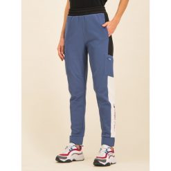 Spodnie dresowe Tommy Sport Dwr Fleece S10S100400. Czerwone spodnie damskie Tommy Sport, s, z poliesteru. W wyprzedaży za 339,00 zł.