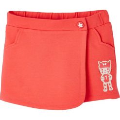 Spódnico-spodnie w kolorze pomarańnczowym. Pomarańczowe spodnie niemowlęce Vertbaudet Girls & Co., z haftami. W wyprzedaży za 29,95 zł.
