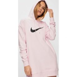 Nike Sportswear - Sukienka. Różowe sukienki damskie marki Nike Sportswear, na co dzień, s, z nadrukiem, z bawełny, casualowe, z kapturem, bez rękawów, mini, proste. Za 239,90 zł.