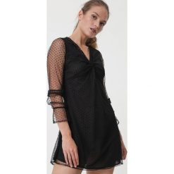 Czarna Sukienka Fortaleza. Czarne sukienki damskie Born2be, na co dzień, s, bez wzorów, z falbankami, z długim rękawem, długie, mini, proste. Za 109,99 zł.