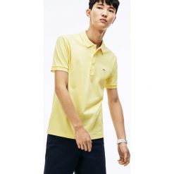 Koszulka polo w kolorze żółtym. Żółte koszulki męskie Lacoste, s, z haftami, klasyczne, bez rękawów. W wyprzedaży za 259,95 zł.