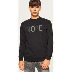 Bluza z aplikacją Nope - Czarny. Czarne bluzy męskie rozpinane marki Reserved, l, z aplikacjami. Za 99,99 zł.