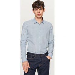 Koszula z podwijanymi rękawami slim fit - Turkusowy. Niebieskie koszule męskie slim marki Reserved, s. W wyprzedaży za 59,99 zł.