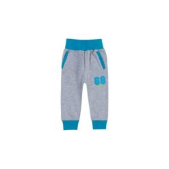 Spodnie niemowlęce chłopięce sportowe. Niebieskie spodnie niemowlęce TXM, bez wzorów, sportowe. Za 19,99 zł.