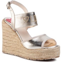 Espadryle LOVE MOSCHINO - JA1608BI0AJB0900 Platino. Żółte espadryle damskie Love Moschino, bez wzorów, ze skóry, bez obcasa, na obcasie. W wyprzedaży za 939,00 zł.