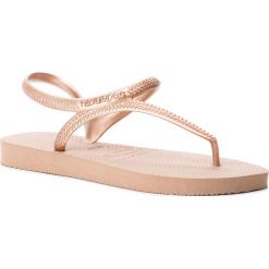 Sandały HAVAIANAS - Fl Urban 40000393581 Rose Gold. Żółte klapki damskie Havaianas, bez wzorów, z tworzywa sztucznego, bez obcasa. W wyprzedaży za 89,00 zł.