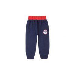 Spodnie niemowlęce chłopięce sportowe. Niebieskie spodnie niemowlęce TXM, bez wzorów, sportowe. Za 15,99 zł.