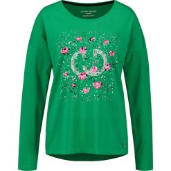 Koszulka w kolorze zielonym. Zielone koszulki damskie Gerry Weber, bez wzorów, z okrągłym kołnierzem, z długim rękawem. W wyprzedaży za 55,95 zł.