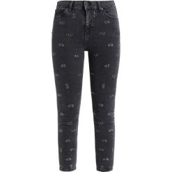 Topshop PIERCED JAMIE Jeans Skinny Fit black. Czarne rurki damskie marki Topshop, z elastanu. W wyprzedaży za 305,10 zł.