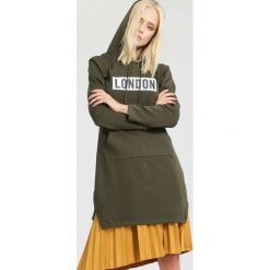 Bluzy damskie: Ciemnozielona Bluza Coextending
