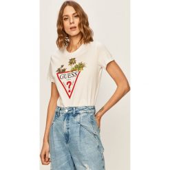Guess Jeans - T-shirt. Białe bluzki damskie Guess Jeans, s, z nadrukiem, z bawełny, casualowe, z okrągłym kołnierzem. W wyprzedaży za 99,90 zł.