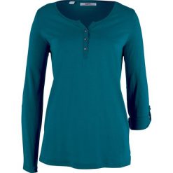 Shirt bawełniany z plisą guzikową, długi rękaw bonprix niebieskozielony morski. Niebieskie tuniki damskie bonprix, bez wzorów, z bawełny, bez kołnierzyka, z długim rękawem. Za 49,99 zł.