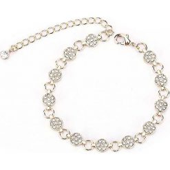 Pozłacana bransoletka z kryształkami Swarovski. Żółte bransoletki damskie METROPOLITAN, z materiału, z kryształem, złote. W wyprzedaży za 42,95 zł.
