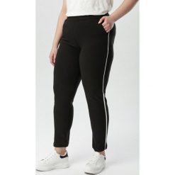 Czarne Legginsy Melva. Czarne legginsy sportowe damskie Born2be, xl, w paski, z dzianiny. Za 39,99 zł.