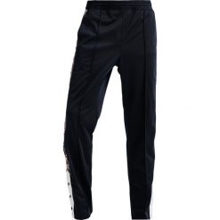 Champion Reverse Weave SPECIAL SEMI DULL Spodnie treningowe navy. Niebieskie spodnie dresowe męskie marki Champion Reverse Weave, xl, z poliesteru. Za 359,00 zł.