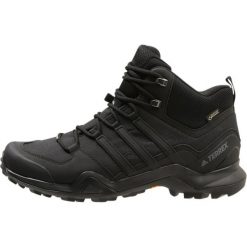 Adidas Performance TERREX SWIFT R2 MID GTX Buty trekkingowe core black. Czarne buty sportowe męskie marki adidas Performance, z tworzywa sztucznego, bez zapięcia, outdoorowe. Za 679,00 zł.