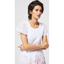 Sukienka z kwiecistym nadrukiem. Sukienki damskie Moodo, xs, z nadrukiem, bez kołnierzyka, bez rękawów. Za 29,99 zł.
