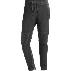 Tigha TREVOR ZIP Spodnie treningowe vintage grey. Szare spodnie dresowe męskie marki Tigha, z bawełny. Za 379,00 zł.