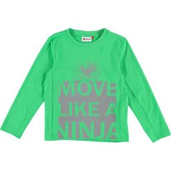 Koszulka "Tiger 116" w kolorze zielonym. Zielone t-shirty chłopięce LEGO Wear, z nadrukiem, z długim rękawem. W wyprzedaży za 49,95 zł.