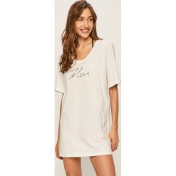 Karl Lagerfeld - T-shirt. Czarne bluzki damskie KARL LAGERFELD, s, z aplikacjami, z bawełny, z okrągłym kołnierzem. Za 369,90 zł.
