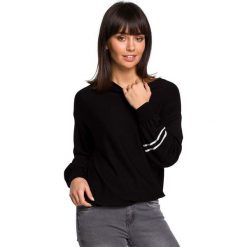 Czarny Nietoperzowy Sweter z Bufiastym Rękawem z Lampasami. Czarne swetry dziewczęce Molly.pl, bez wzorów, z dzianiny, eleganckie, bez kołnierzyka, bez rękawów, bez kaptura. Za 115,90 zł.