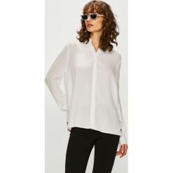 Tommy Jeans - Koszula. Białe bluzki damskie marki Tommy Jeans, na co dzień, s, bez wzorów, z wiskozy, casualowe, bez kołnierzyka, z długim rękawem. Za 399,90 zł.