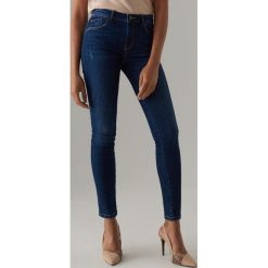 Jeansy skinny z przetarciami - Niebieski. Niebieskie jeansy damskie Mohito. Za 109,99 zł.