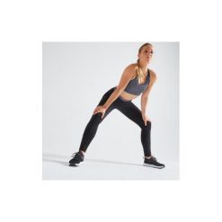 Legginsy fitness kardio damskie 100 czarne. Czarne legginsy sportowe damskie DOMYOS, l, bez wzorów, z elastanu, na fitness i siłownię. Za 49,99 zł.