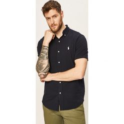 Polo Ralph Lauren - Koszula. Niebieskie koszule męskie Polo Ralph Lauren, s, bez wzorów, z bawełny, casualowe, polo, z krótkim rękawem. W wyprzedaży za 299,90 zł.