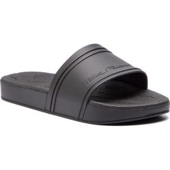 Klapki MELISSA - Slide + Rider Ad 32434 Black 01003. Czarne klapki damskie marki Melissa, bez wzorów, z tworzywa sztucznego, bez obcasa. Za 279,00 zł.