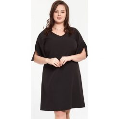 Czarna sukienka Eliza XXL OVERSIZE. Czarne sukienki damskie Moda Size Plus Iwanek, xxl, bez wzorów, z elastanu, eleganckie, z klasycznym kołnierzykiem, bez rękawów, trapezowe. Za 159,00 zł.