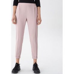Spodnie typu jogger - Różowy. Różowe spodnie damskie House, xl. W wyprzedaży za 39,99 zł.