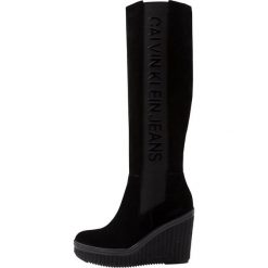 Calvin Klein Jeans SELENE Kozaki na obcasie black. Czarne buty zimowe damskie Calvin Klein Jeans, z jeansu, na obcasie. Za 929,00 zł.