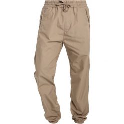 Chinosy męskie: Carhartt WIP VALIANT COLUMBIA Spodnie materiałowe leather rinsed