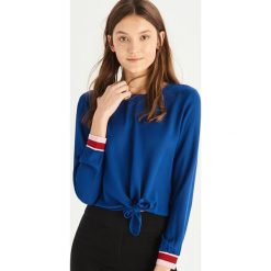 Bluzka z wiązaniem - Niebieski. Niebieskie bluzki damskie marki Sinsay, s, bez wzorów, bez kołnierzyka, bez rękawów. Za 39,99 zł.