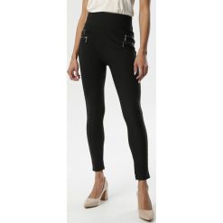 Czarne Legginsy Melvie. Czarne legginsy damskie Born2be, xl, bez wzorów, z dzianiny. Za 49,99 zł.