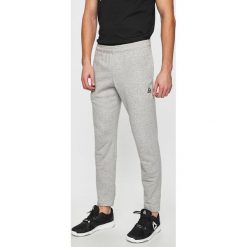 Reebok - Spodnie. Szare spodnie męskie Reebok, s, z bawełny, sportowe. W wyprzedaży za 129,90 zł.