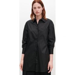 Elegancka tunika -. Tuniki damskie Reserved, bez wzorów, eleganckie, bez kołnierzyka, bez rękawów. Za 99,99 zł.