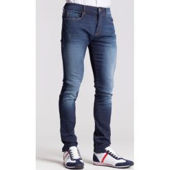 Granatowe jeansy męskie z przetarciami slim fit. Niebieskie jeansy męskie Trussardi Jeans, m, z aplikacjami. Za 256,00 zł.