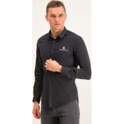 Koszula Iceberg Camicia 19EI1P0G0206210. Czarne koszule męskie Iceberg, m, bez wzorów, z elastanu, casualowe, bez kołnierzyka, bez rękawów. W wyprzedaży za 369,00 zł.