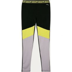 Guess Jeans - Legginsy dziecięce 116-175 cm. Czarne spodnie dziewczęce Guess Jeans, z aplikacjami, z elastanu. Za 139,90 zł.