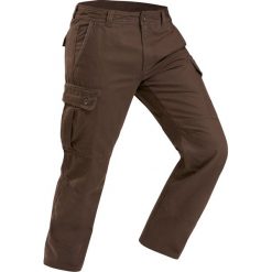 Spodnie turystyczne - TRAVEL 100 warm - męskie. Pomarańczowe spodnie męskie QUECHUA, s, bez wzorów, z bawełny. Za 129,99 zł.