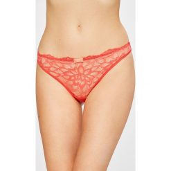 Triumph - Stringi Dream Spotlight. Pomarańczowe stringi damskie marki Triumph, z elastanu. W wyprzedaży za 49,90 zł.