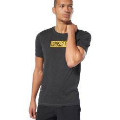 Reebok Koszulka Czarny. Czarne podkoszulki męskie Reebok, xxl, z nadrukiem, z bawełny, krótkie. Za 171,95 zł.